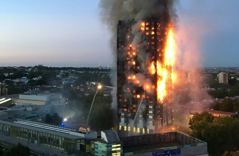 This handout image received by local resident Natalie Oxford early on June 14, 2017 shows flames and smoke coming from Grenfell Tower in west London