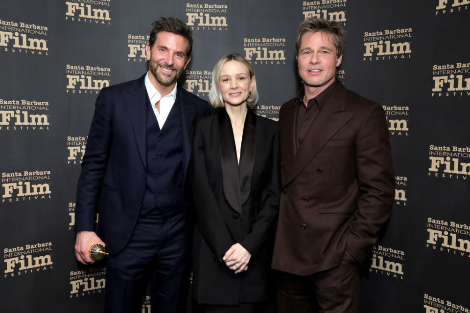 Three people standing together at the Santa Barbara Film Festival, with a patterned backdrop. The individuals are unidentified in this description