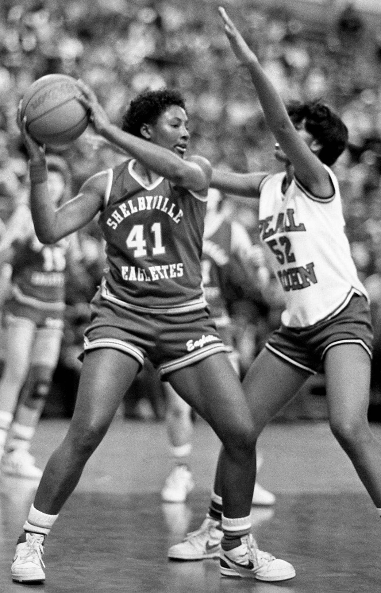 Angela Moorehead, Shelbyville High (1985-87): Here, Moorehead (41) looks for a teammate to pass the ball after grabbing a rebound as Pearl-Cohn High’s Kim Walkert (52) defends on Feb. 7, 1987.