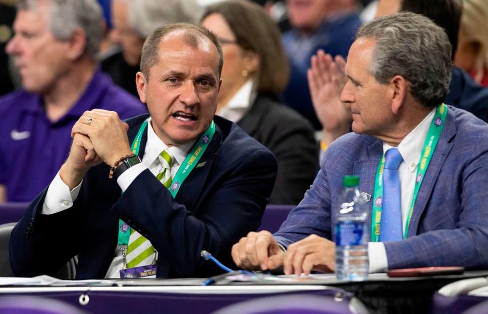 ACC Commissioner Jim Phillips talks with North Carolina Athletic Director Bubba Cunningham during the NCAA Tournament game between North Carolina and Duke at Caesars Superdome in New Orleans, La. on Saturday April 2, 2022.