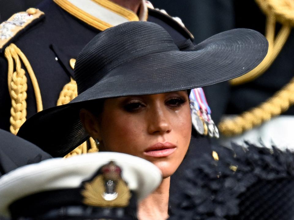 Meghan Markle sheds a tear at Queen Elizabeth's funeral.