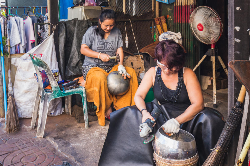 Hand made creation of iron bowl at the Monk Bowl Village (Baan Bat), Thailand. Bangkok, Thailand - December 09 2017.