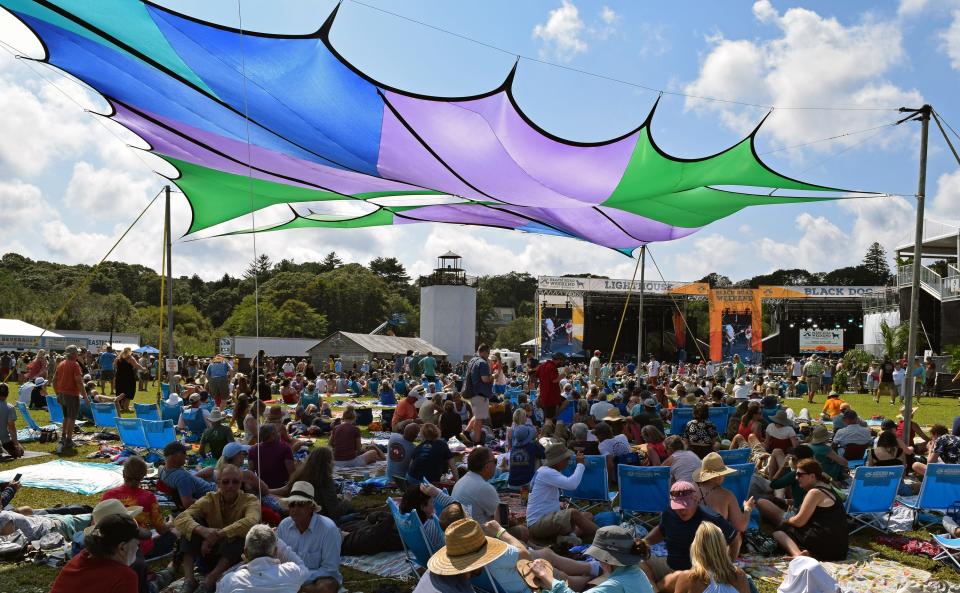 Crowds gathered under colorful canopies to watch bands across two stages during last year's Beach Road Weekend.