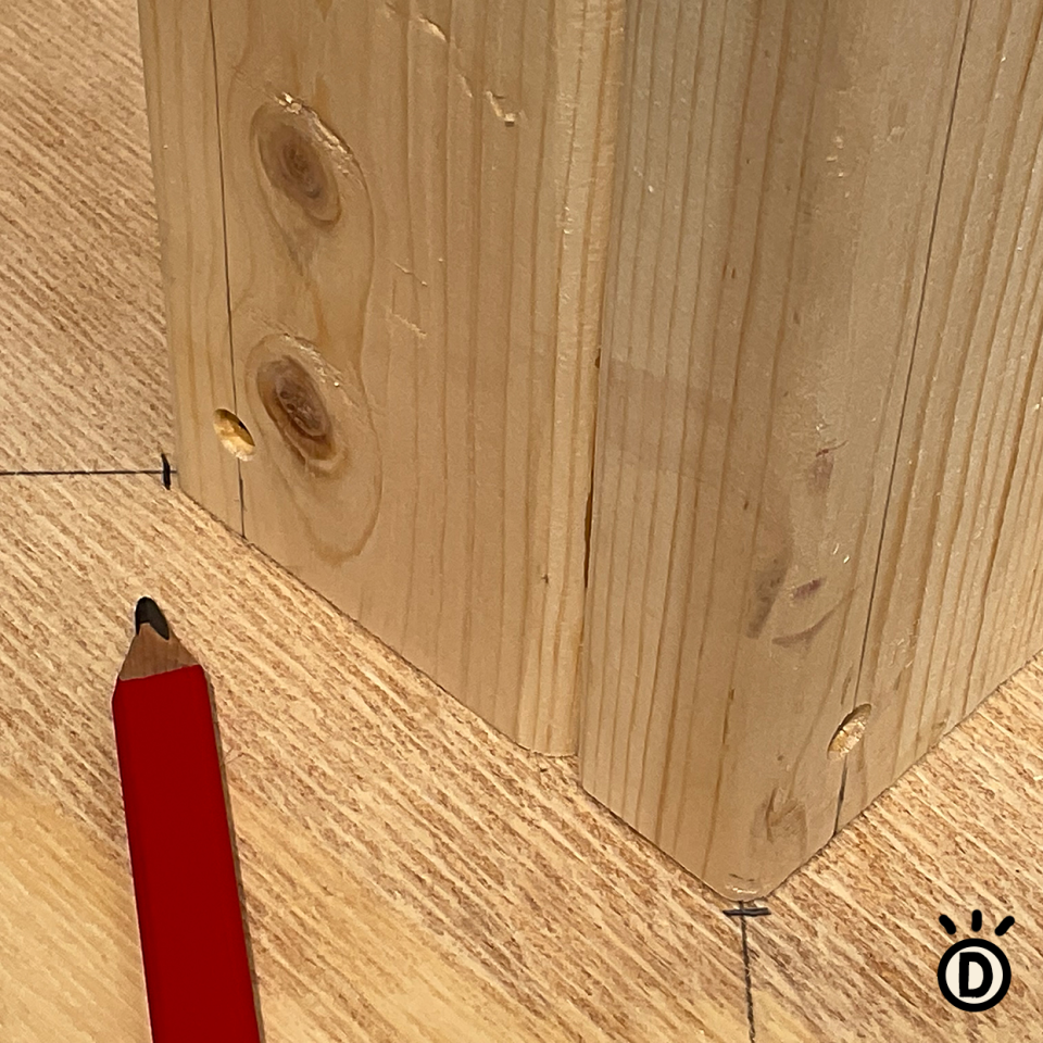 diy cat scratcher how-to marking wood center post with a pencil