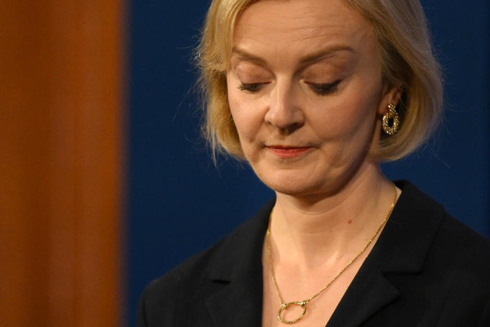 Britain's Prime Minister Liz Truss looks down during a press conference in the Downing Street Briefing Room in central London on October 14, 2022, following the sacking of the finance minister in response to a budget that sparked markets chaos. - Truss dismissed her finance minister, forcing Kwasi Kwarteng to carry the can for turmoil sparked by her right-wing economic platform as restive Conservatives plotted her own demise. (Photo by Daniel LEAL / POOL / AFP) (Photo by DANIEL LEAL/POOL/AFP via Getty Images)