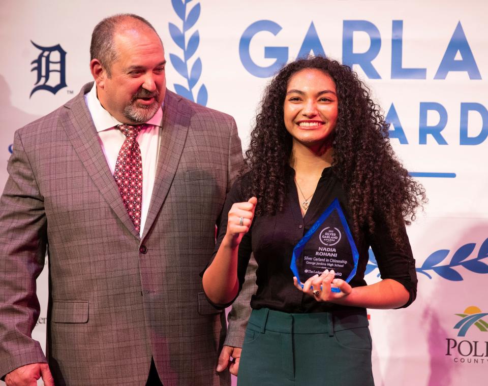 Superintendent of Schools Frederick Heid presents Nadia Rohani of George Jenkins High School with the Silver Garland Award for Citizenship.