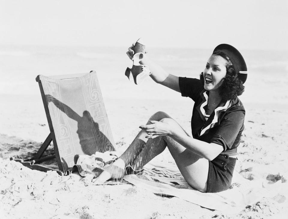 <p>Raquel Torres dumps sand out of her shoe in 1935.</p>