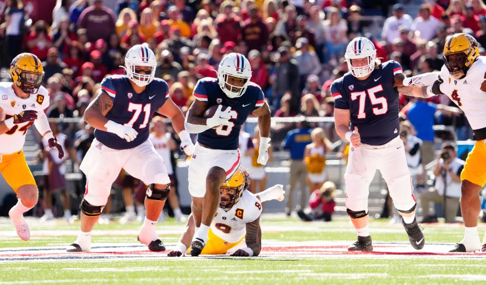 Nov 25, 2022; Tucson, AZ, USA;  Arizona Wildcats running back Michael Wiley (6) runs for a touchdown against the Arizona State Sun Devils in the first half during the Territorial Cup game at Arizona Stadium.