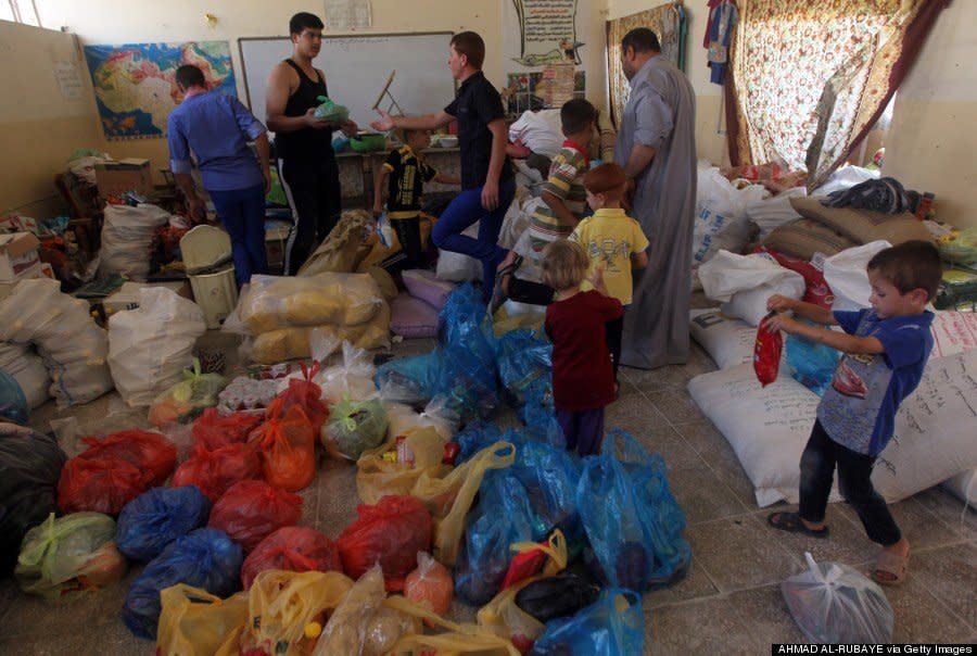 Iraqi Turkmen Shiite families displaced from the northern Iraqi area of Tal Afar take shelter in a school in Sadr City, Baghdad, on August 5, 2014. (AHMAD AL-RUBAYE/AFP/Getty Images) 