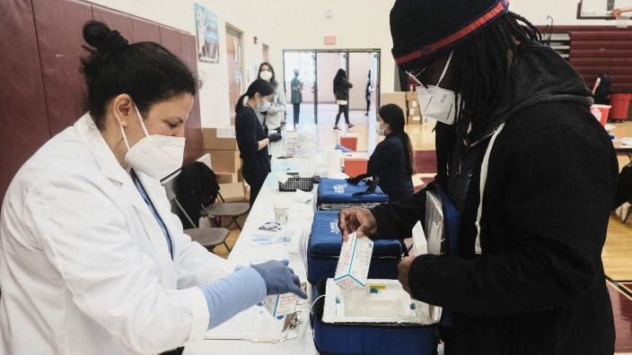 Moderna COVID-19 vaccines are delivered to a pop-up clinic in April at Western International High School in Detroit, Michigan. (Photo by Matthew Hatcher/Getty Images)