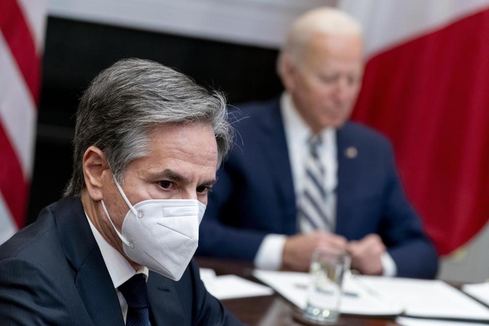 FILE - In this March 1, 2021, file photo Secretary of State Antony Blinken, left, is visible as President Joe Biden, right, holds a virtual meeting with Mexican President Andres Manuel Lopez Obrador in the Roosevelt Room of the White House in Washington. Blinken and Defense Secretary Lloyd Austin are heading to Japan and South Korea for four days of talks starting Monday, March 15, as the administration seeks to shore up partnerships with the two key regional treaty allies. (AP Photo/Andrew Harnik, File)