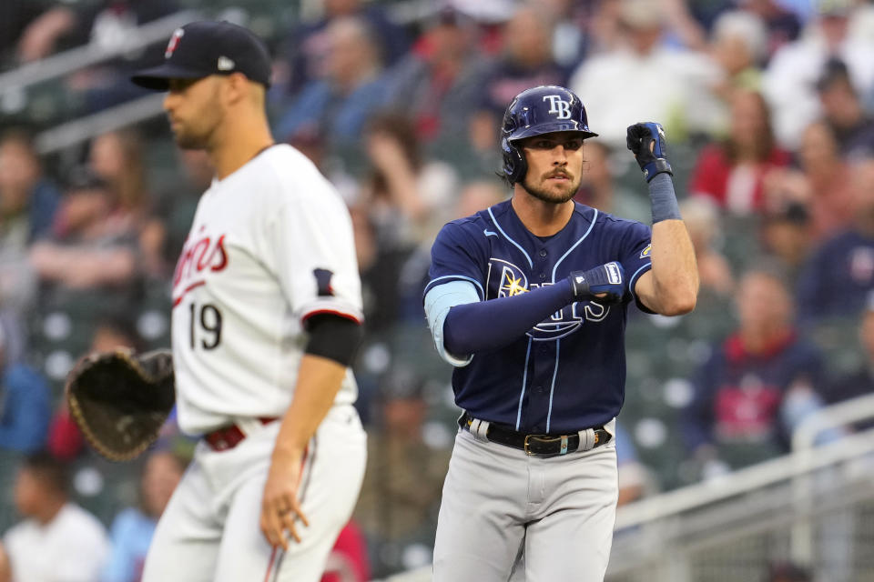Tampa Bay Rays' Josh Lowe, right, celebrates after hitting an RBI single during the first inning of a baseball game against the Minnesota Twins, Monday, Sept. 11, 2023, in Minneapolis. (AP Photo/Abbie Parr)