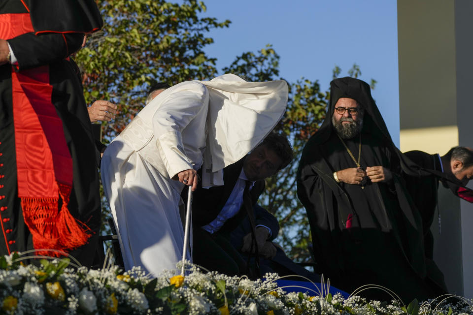 A ghost of wind lifts Pope Francis' mantella as he arrives at the Memorial dedicated to sailors and migrants lost at sea during a moment of reflection with religious leaders, in Marseille, France, Friday, Sept. 22, 2023. Francis, during a two-day visit, will join Catholic bishops from the Mediterranean region on discussions that will largely focus on migration. (AP Photo/Alessandra Tarantino)