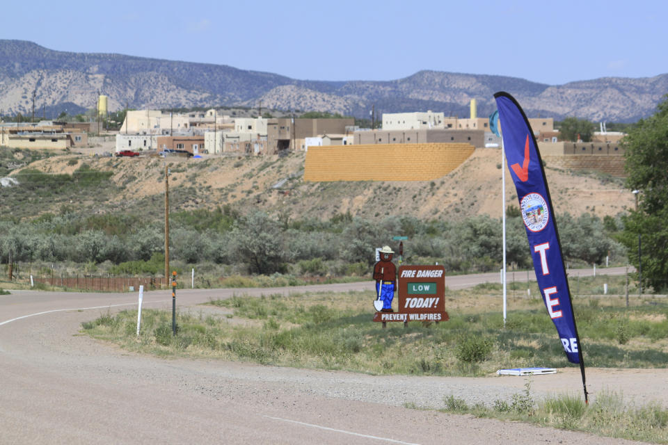 A banner directs voters to an early voting center at tribal headquarters at Zia Pueblo, New Mexico, on Wednesday, May 22, 2024. An act of Congress a century ago granted U.S. citizenship to Native Americans, marking the start of a long journey to secure voting rights. (AP Photo/Susan Montoya Bryan)