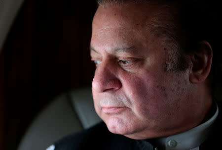 Pakistani Prime Minister Nawaz Sharif looks out the window of his plane after attending a ceremony to inaugurate the M9 motorway between Karachi and Hyderabad, Pakistan February 3, 2017. REUTERS/Caren Firouz