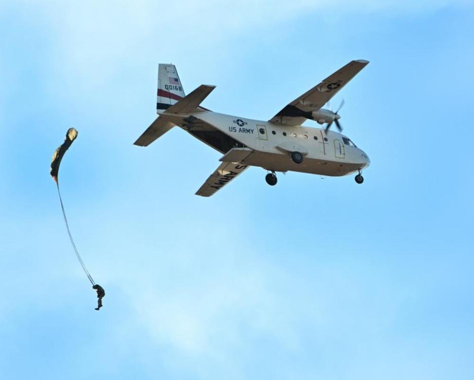 A soldier from the U.S. Army John F. Kennedy Special Warfare Center and School jumps from the tailgate of a Casa 212 aircraft over Sicily Drop Zone at Fort Bragg, on Dec. 1, 2022.