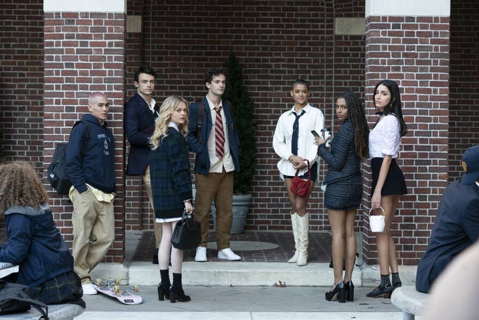 The new cast of Gossip Girl gathered around the courtyard at school