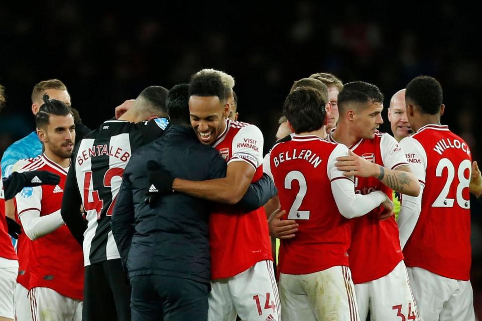 Together: Aubameyang says the squad feel better playing under Arteta Photo: AFP via Getty Images