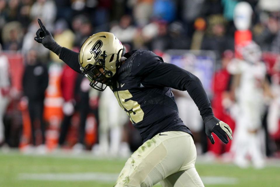 Purdue defensive end DaMarcus Mitchell (15) celebrates a sack during the fourth quarter of an NCAA college football game, Saturday, Nov. 27, 2021 at Ross-Ade Stadium in West Lafayette.