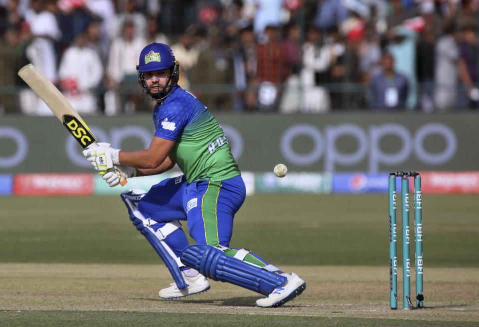 Multan Sultans batsman Rilee Rossouw follows the ball after playing a shot for boundary during their Pakistan Super League T20 cricket match against Quetta Gladiators, in Multan, Pakistan, Saturday, Feb. 29, 2020. (AP Photo/K.M. Chaudary)