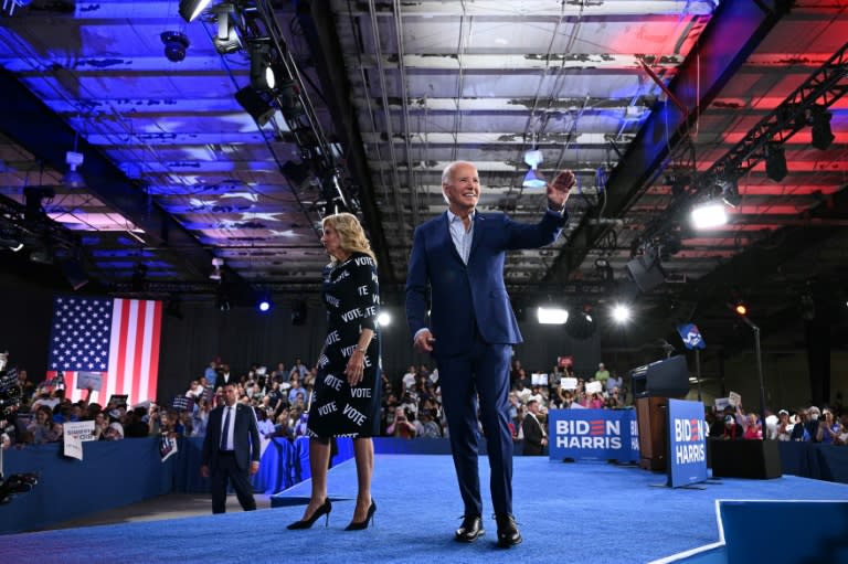 US President Joe Biden and First Lady Jill Biden walk off the stage after a campaign event in Raleigh, North Carolina, on June 28, 2024 (Mandel NGAN)