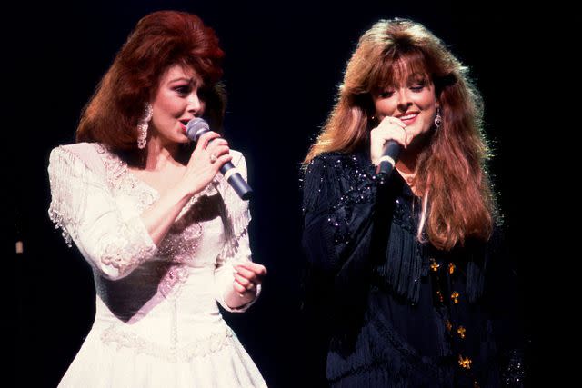 Paul Natkin/Getty Naomi and Wynonna Judd perform in 1991