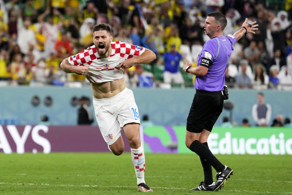 Croatia's Bruno Petkovic celebrates scoring his side's opening goal during the World Cup quarterfinal soccer match between Croatia and Brazil, at the Education City Stadium in Al Rayyan, Qatar, Friday, Dec. 9, 2022. (AP Photo/Manu Fernandez)