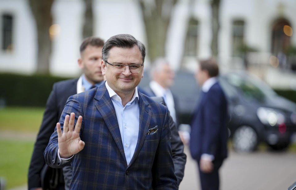 Dmytro Kuleba, foreign minister of Ukraine, waves as he arrives for the G7 Group of leading democratic economic powers at the Weissenhaus resort in Weissenhaeuser Strand, Germany, Friday May 13, 2022. In addition to the United States and Germany, the G7 also includes Great Britain, France, Italy, Canada and Japan. The main topic of the meeting is the war in Ukraine. (Kay Nietfeld/DPA via AP, Pool)