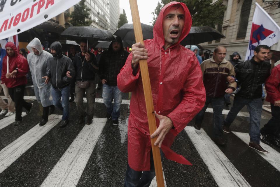 Protesters from the Communist-affiliated trade union PAME march during a general 24 hour labour strike in Athens