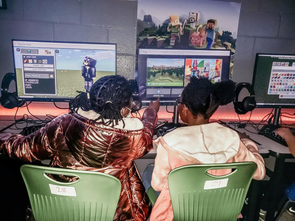 Two students work together during a coding class at Springfield Middle School in Jacksonville, Florida. The class takes place inside the school's Minecraft Lab — which uses the popular video game as a basis to learn skills including math and code. Math specialist Nadine Ebri uses the Minecraft Lab to teach culturally relevant curriculum to students.