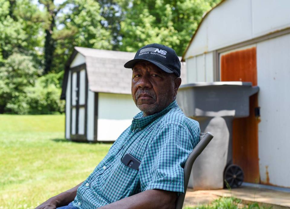 Thaddeus Johnson, 70, sits in his neighbor’s backyard, two doors down from where Ahmad Wrighten, 12, was shot and killed late Thursday, June 15, 2023.
