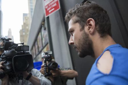 Actor Shia LaBeouf exits Midtown Community Court in New York June 27, 2014. REUTERS/Brendan McDermid