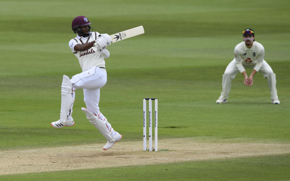 West Indies' Kraigg Brathwaite, left, hits a boundary during the third day of the first cricket Test match between England and West Indies, at the Ageas Bowl in Southampton, England, Friday, July 10, 2020. (Mike Hewitt/Pool via AP) (Mike Hewitt/Pool via AP)