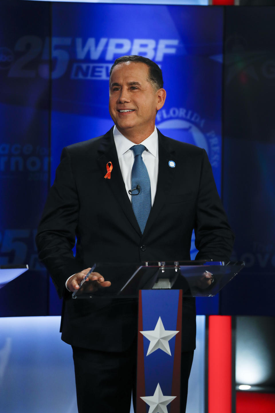 Democratic gubernatorial candidate Philip Levine awaits the start of a debate ahead of the Democratic primary for governor, Thursday, Aug. 2, 2018, in Palm Beach Gardens, Fla. (AP Photo/Brynn Anderson)
