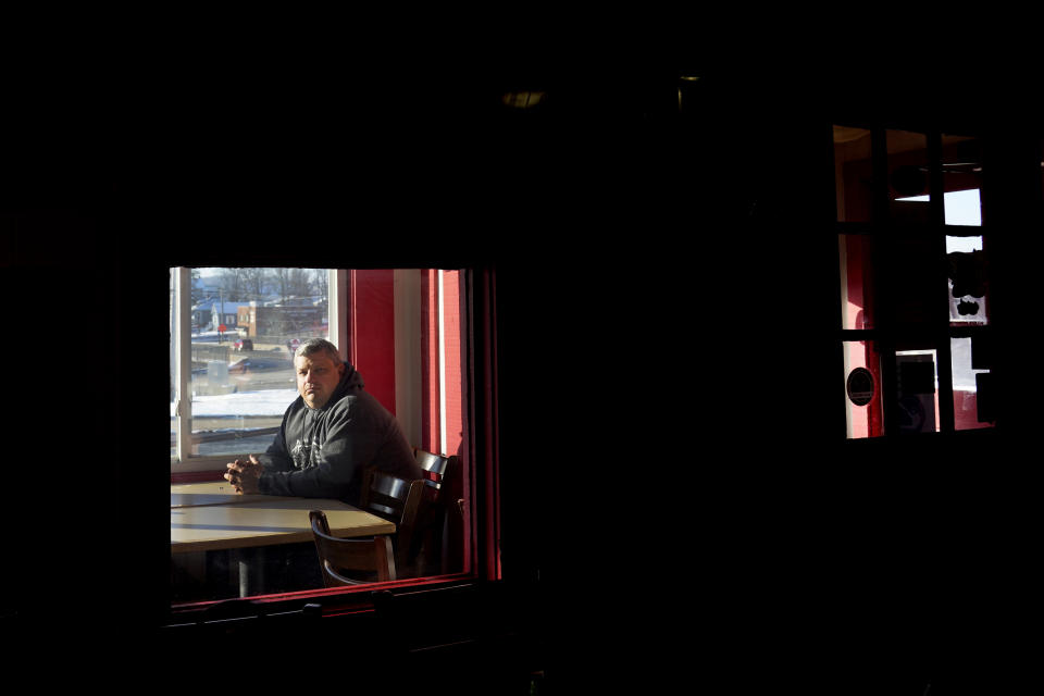 Jeff Fitter, owner of Super Smokers BBQ, poses for a photo inside his restaurant Thursday, Jan. 28, 2021, in Eureka, Mo. Fitter says his profits were down by about half last year, largely because of the closures and capacity limits imposed by St. Louis County. He is supporting a bill that would limit local emergency health orders to 14 days unless authorized for longer by the Legislature. (AP Photo/Jeff Roberson)