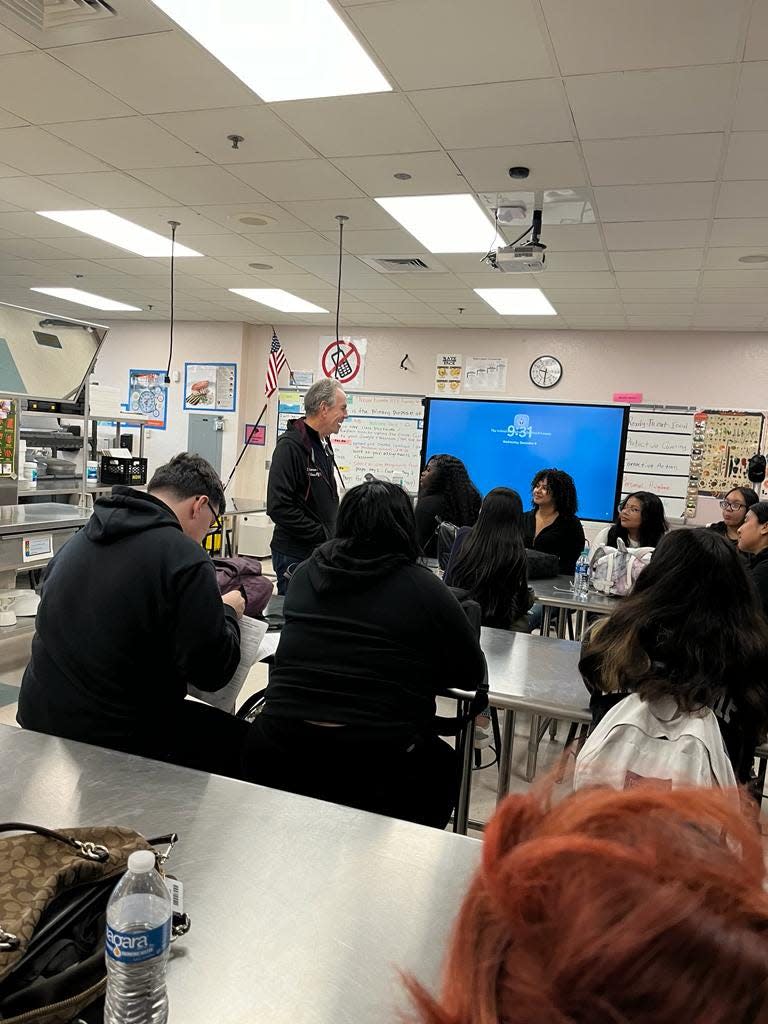 Chef Thomas Keller speaking to Lake Worth Community High School Culinary Arts students after enjoying a lunch catered by those same students.