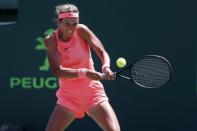 Mar 29, 2018; Key Biscayne, FL, USA; Victoria Azarenka of Belarus hits a backhand against Sloane Stephens of the United States (not pictured) in a women's singles semi-final of the Miami Open at Tennis Center at Crandon Park. Mandatory Credit: Geoff Burke-USA TODAY Sports