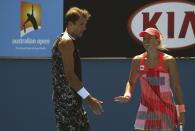 Poland's Lukasz Kubot (L) and Czech Republic's Andrea Hlavackova react during their mixed doubles match at the Australian Open tennis tournament at Melbourne Park, Australia, January 25, 2016. REUTERS/John French