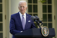 President Joe Biden listens as Japanese Prime Minister Yoshihide Suga speaks at a news conference in the Rose Garden of the White House, Friday, April 16, 2021, in Washington. (AP Photo/Andrew Harnik)