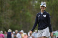 Nelly Korda of the U.S. smiles after putting on the first green during the third round of the LPGA Tour Championship golf tournament, Saturday, Nov. 20, 2021, in Naples, Fla. (AP Photo/Rebecca Blackwell)