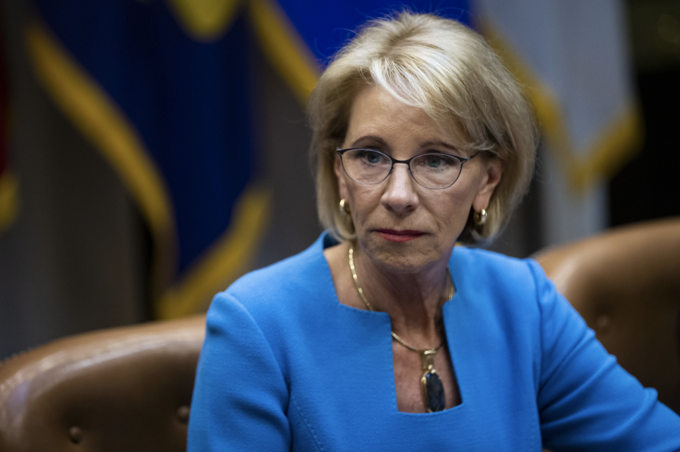 Betsy DeVos, U.S. secretary of education, listens during a roundtable discussion with U.S. President Donald Trump on the Federal Commission on School Safety report in the Roosevelt Room at the White House in Washington, D.C., U.S., on Tuesday, Dec. 18, 2018. (Photo: Al Drago/Bloomberg via Getty Images)