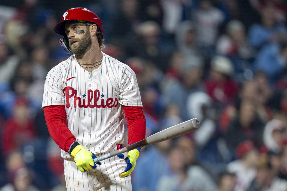 Philadelphia Phillies' Bryce Harper reacts to lining out during the sixth inning of a baseball game against the Cincinnati Reds, Monday, April 1, 2024, in Philadelphia. (AP Photo/Chris Szagola)