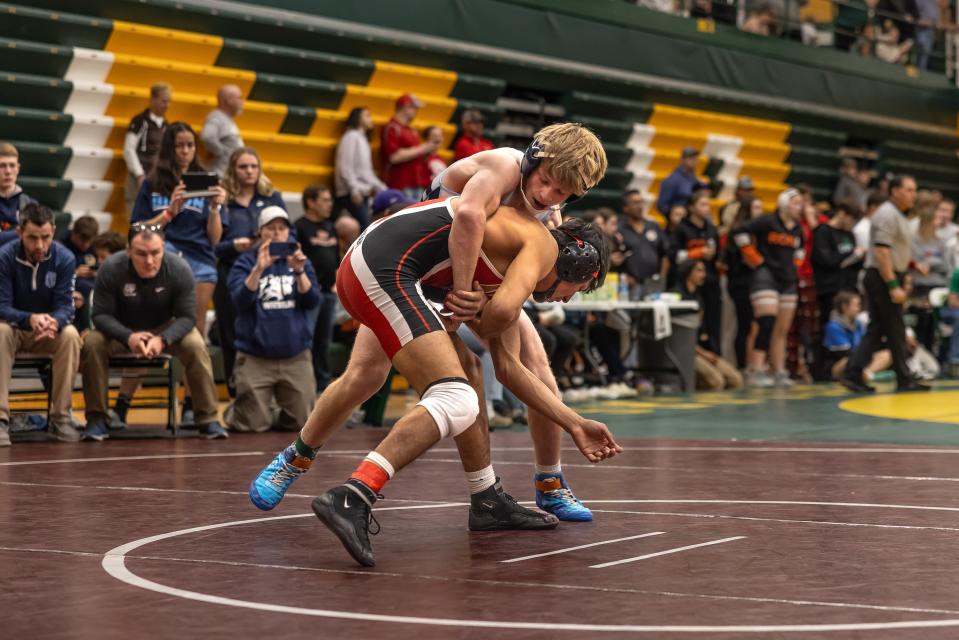 Great Falls High wrestling's Jace Komac looks to take down his opponent in a match at the CMR Holiday Classic on Saturday. Komac was one of four individual champions for the second-place Bison, including Cael Floerchinger, Kale Baumann and Dylan Block.