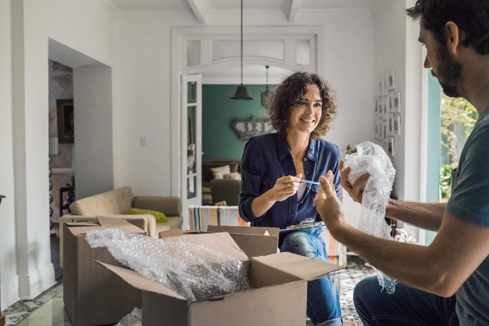 If you bring up un-moving with your partner, do so sensitively. (Photo: Portra via Getty Images)