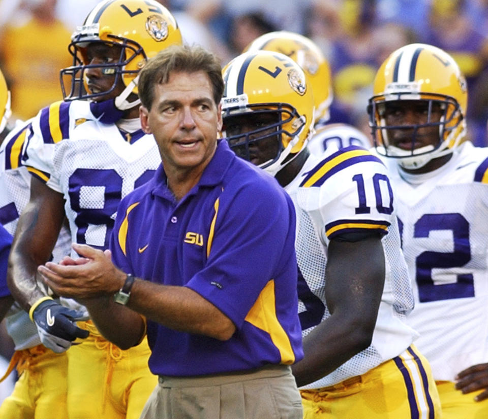 FILE - In this Sept. 11, 2004, file photo, LSU coach Nick Saban encourages his players before an NCAA college football game against Arkansas State in Baton Rouge, La. Nick Saban is retiring after leading Alabama to six national titles in 17 seasons and winning another at LSU, Wednesday, Jan. 10, 2024. (AP Photo/Patrick Dennis, File)