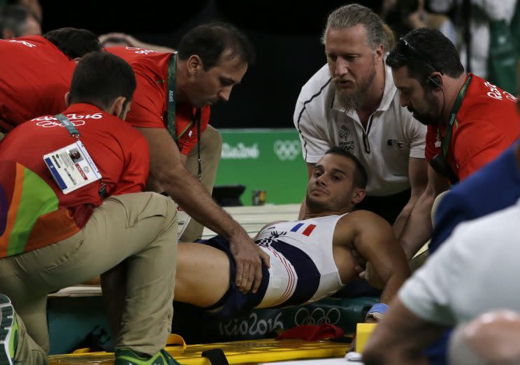 France’s Samir Ait Said is assisted after injuring his leg in the vault. (AP)