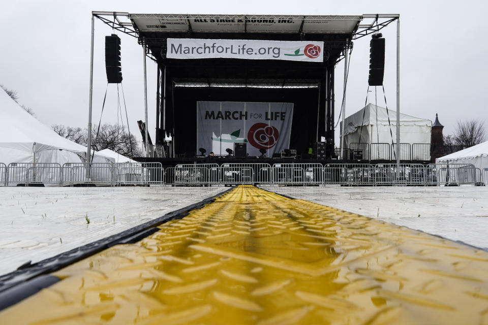 Rain falls on a stage in place for the March for Life rally on the National Mall in Washington, Thursday, Jan. 20, 2022. The March for Life is scheduled to take place Friday, Jan. 21, 2022. (AP Photo/Carolyn Kaster)