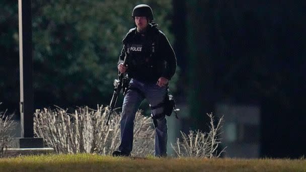 PHOTO: An official walks near a wooded area during a search for a gunman on Feb. 10, 2023, in Fallston, Md. (Julio Cortez/AP)