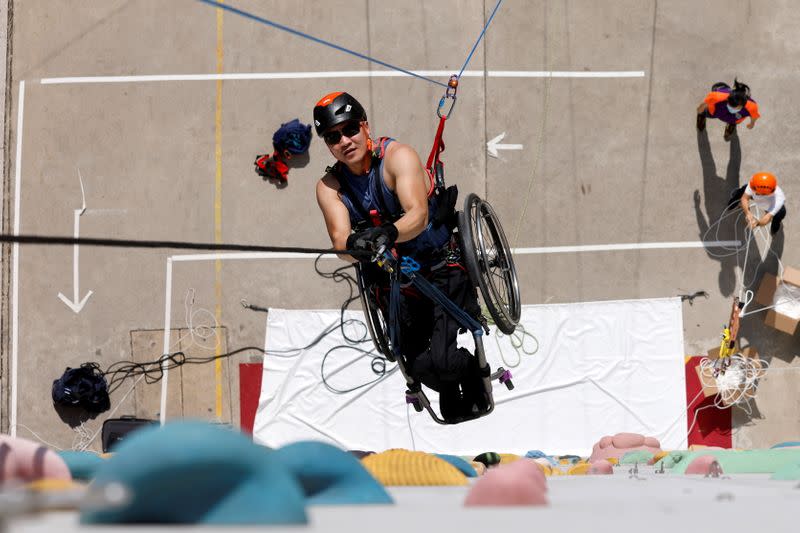 Lai Chi-wai, a paraplegic climber, attends a training session ahead of his attempt to climb the 320-metre tall Nina Tower using his upper body strength, in Hong Kong