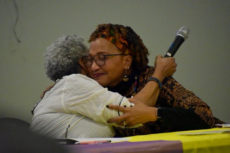 Janyce Jones (left) and Rebecca Hixon embrace during the N.C. Rice Festival Ancestry Reveal in Navassa on Feb. 29, 2024. Both women's DNA traced back to the same region in Africa.